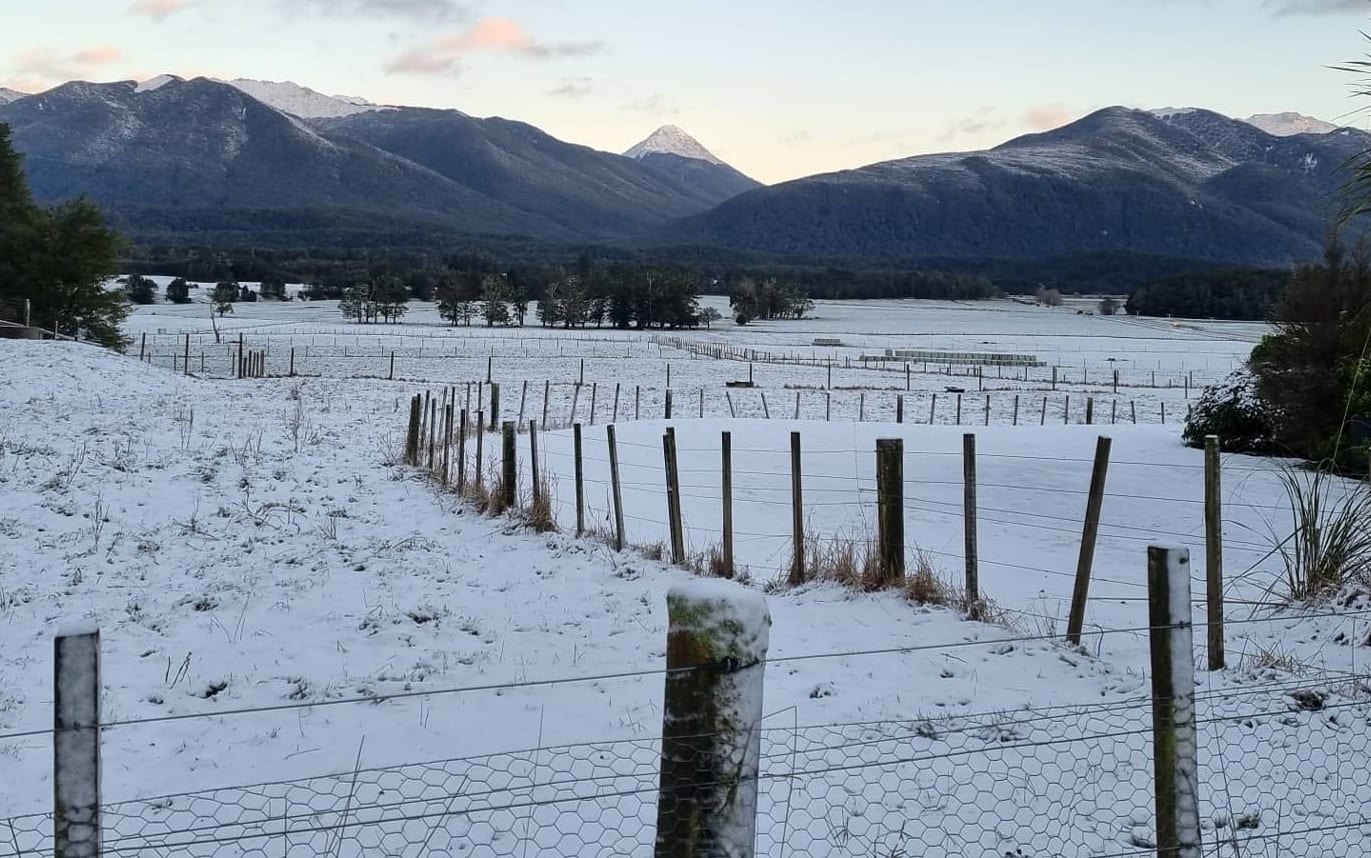 Snow-covered paddock viewed from Lewis Pass Motels.