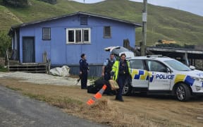 Police officers in Marokopa during search for Phillips family