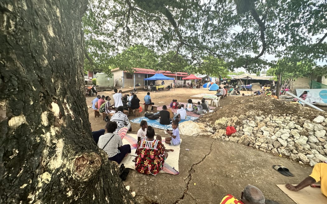 A seaside community in Vanuatu holds an open air church service to bring people together.