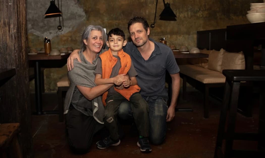 Krishna Botica, Tony McGeorge and their son at their restaurant, Ghost St.