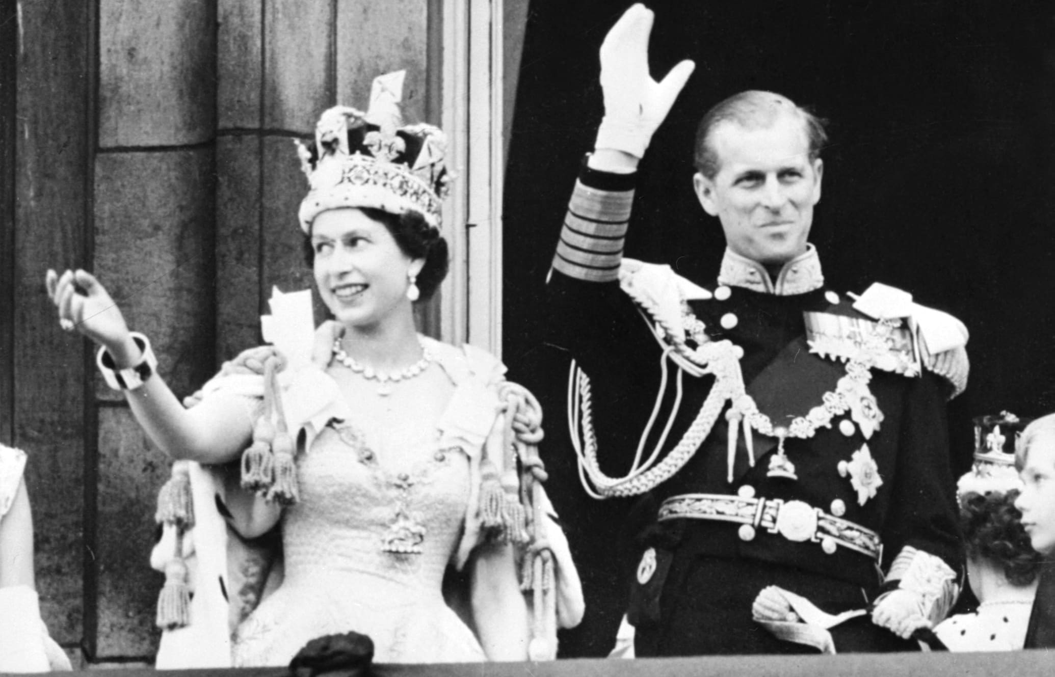 Queen Elizabeth II (L) accompanied by Britain's Prince Philip, Duke of Edinburgh (R) waves to the crowd, June 2, 1953 after being crowned at Westminter Abbey in London.