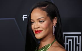 LOS ANGELES, CALIFORNIA - FEBRUARY 11: Rihanna poses for a picture as she celebrates her beauty brands fenty beauty and fenty skin at Goya Studios on February 11, 2022 in Los Angeles, California.   Mike Coppola/Getty Images/AFP (Photo by Mike Coppola / GETTY IMAGES NORTH AMERICA / Getty Images via AFP)