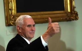 US Vice-President Mike Pence reacts to news sweeping tax reforms have been passed