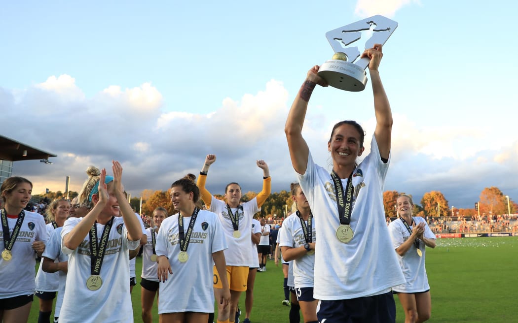 Abby Erceg of North Carolina Courage celebrates with the trophy after defeating the Chicago Red Stars 4-0 to win the 2019 NWSL Championship at WakeMed Soccer Park on October 27, 2019 in Cary, North Carolina.