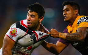 Warriors Second row Ben Henry (L) is tackled by Brisbane Full back Ben Barba (R) during the round 19 NRL match between the Auckland Warriors and the Brisbane Broncos at Suncorp Stadium, 2014.