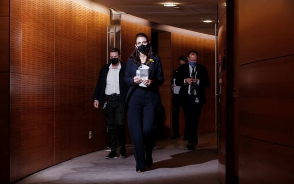 Prime minister Jacinda Ardern and Director General of Health Dr Ashley Bloomfield head into the media briefing about the lockdown.