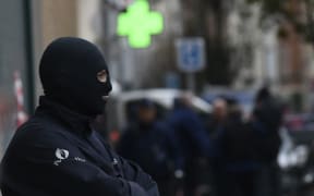 Armed policemen near the scene in Molenbeek-Saint-Jean, Brussels, where Salah Abdeslam was apparently wounded and taken into custody.