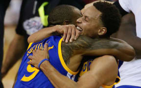 Andre Iguodala and Steph Curry of the Golden State Warriors.