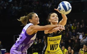 Stars midcourter Temepara Bailey (left) battles with Pulse defender Karin Burger