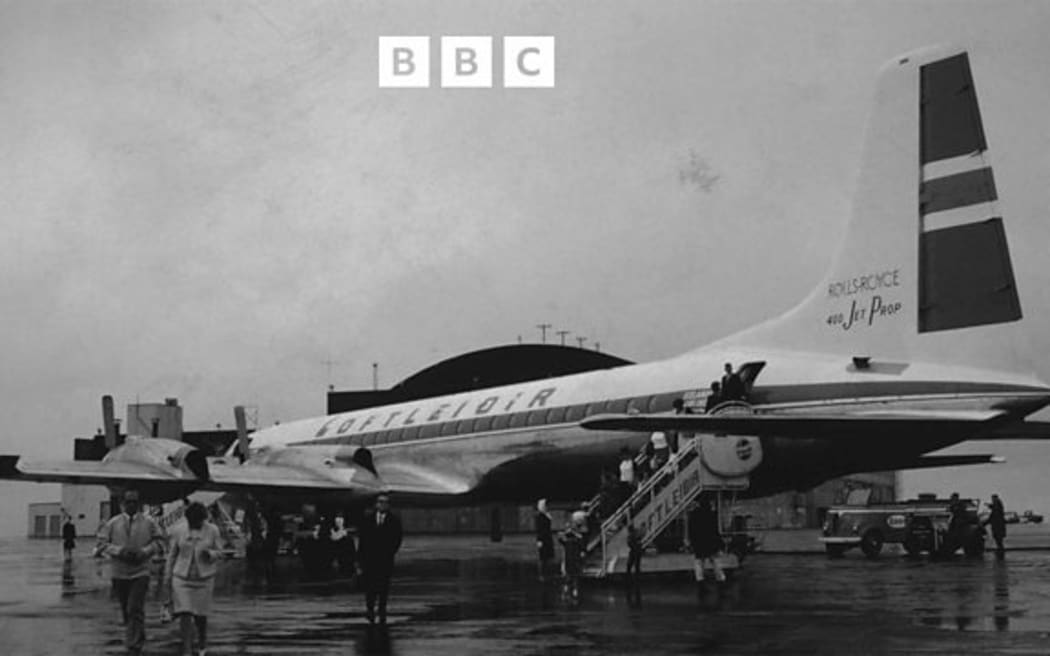 Icelandic Airlines plane, with passengers disembarking, 1965.