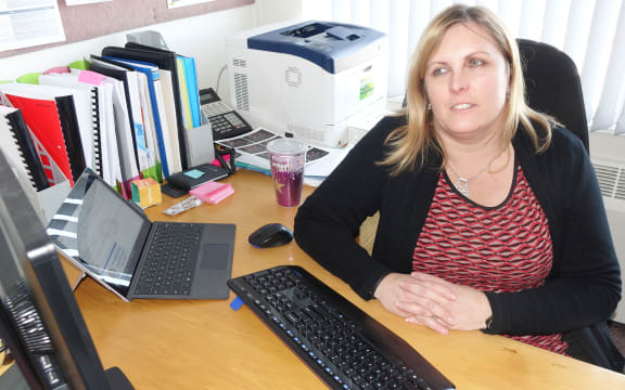 Woman sitting at work desk