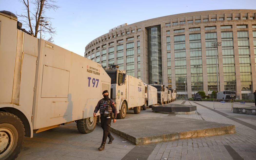 Police forces cordon off the area outside the Caglayan courthouse where Istanbul mayor Ekrem Imamoglu is due to appear before prosecutors, in Istanbul, on 22 March, 2025.