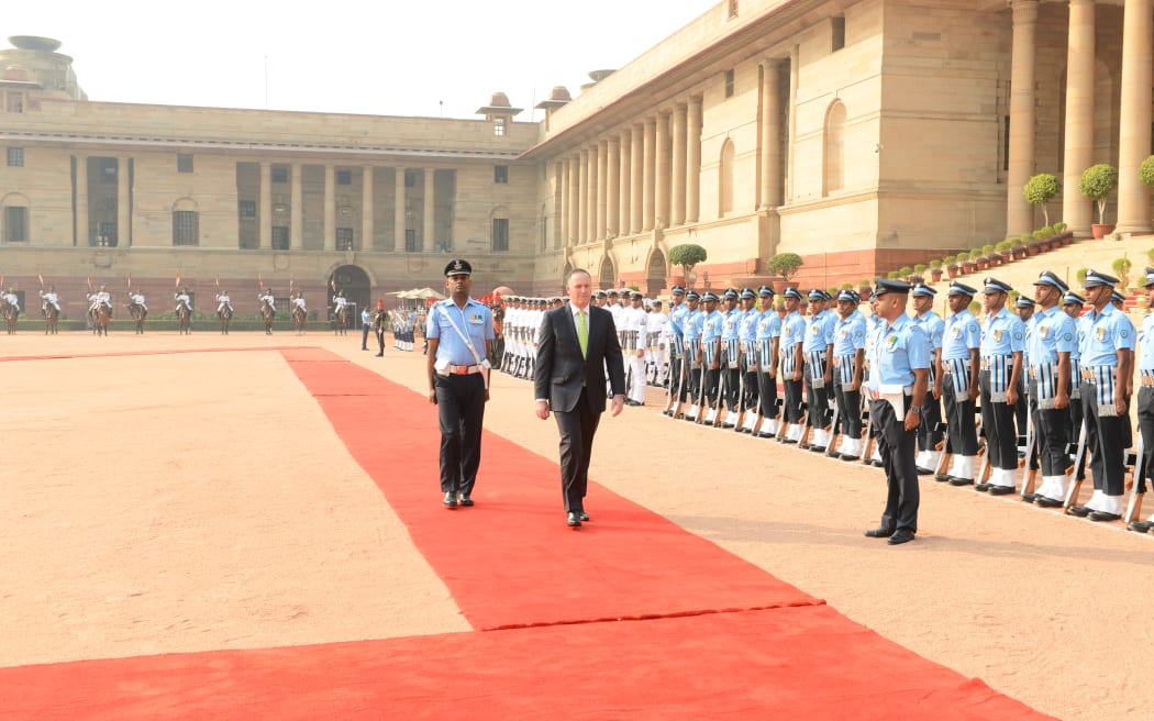 Prime Minister John Key inspects troops at the Indian Presidential Residence in New Delhi on 26 October 2016.