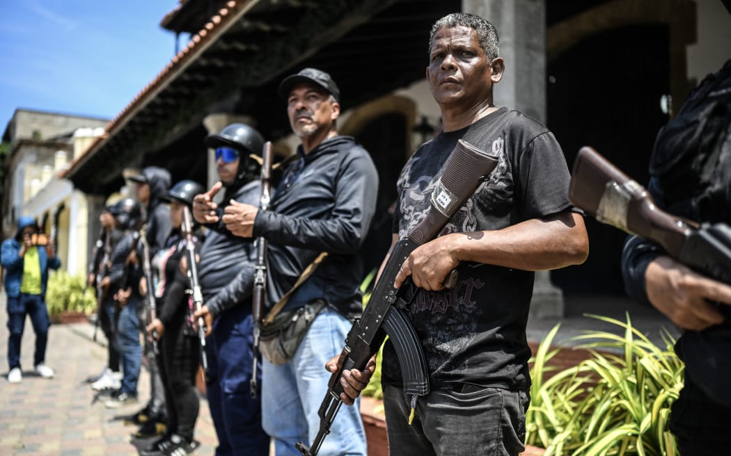 Members of Venezuela's Bolivarian National Militia take part in military training in La Guaira, Venezuela on 8 October, 2025.