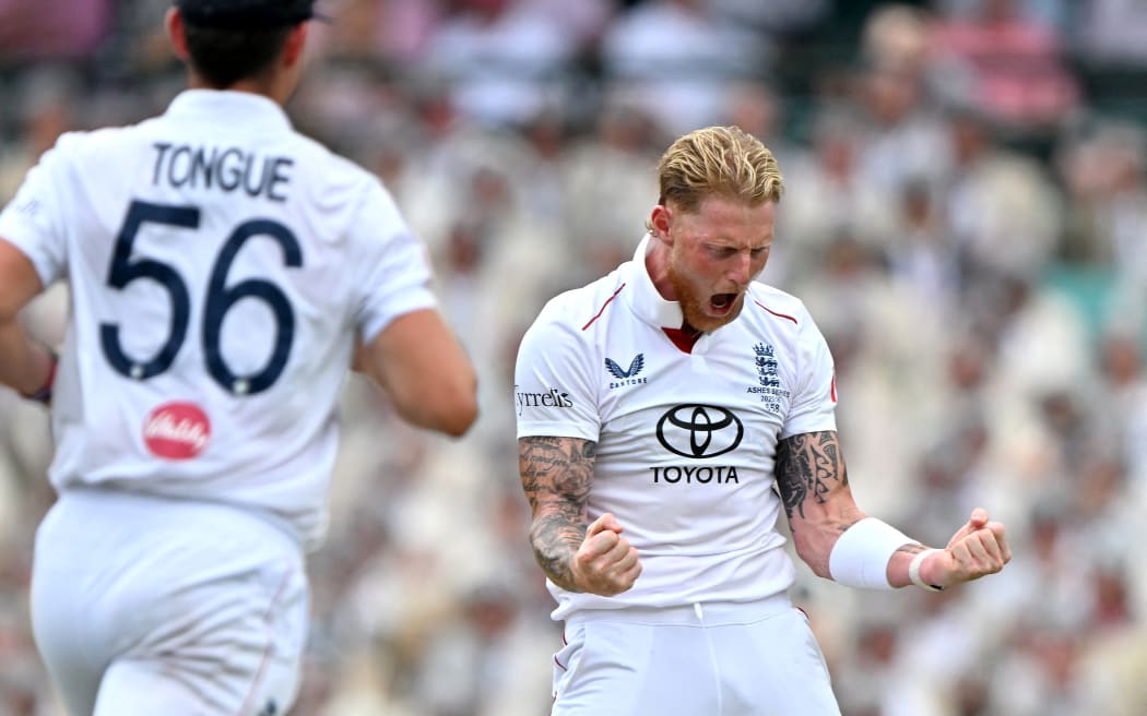 England's captain Ben Stokes (R) celebrates after taking the wicket of Australia's Jake Weatherald on day two of the fifth Ashes cricket Test between Australia and England at the Sydney Cricket Ground in Sydney on January 5, 2026. (Photo by Saeed KHAN / AFP) / -- IMAGE RESTRICTED TO EDITORIAL USE - STRICTLY NO COMMERCIAL USE --