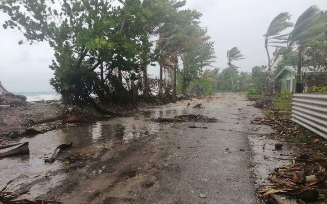 Debris across the one main road on Tuvalu's main atoll, Funafuti.