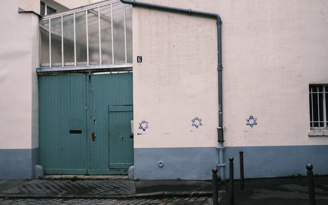 France, Paris, 2023-10-31. Anti-Semitic tags depicting a blue Star of David were painted on the walls of numerous buildings and establishments in the 14th arrondissement in Paris, on the night of October 30-31. Photography by Anna Margueritat / Hans Lucas. France, Paris, 2023-10-31. Des tags antisemites representant une etoile de David bleue ont ete peints sur les murs de nombreux immeubles et etablissements dans le 14eme arrondissement a Paris, dans la nuit du 30 au 31 octobre. Photographie de Anna Margueritat / Hans Lucas. (Photo by Anna Margueritat / Hans Lucas / Hans Lucas via AFP)