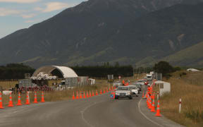 Vehicles head through onto the newly reopened stretch of SH1 north of Kaikoura.