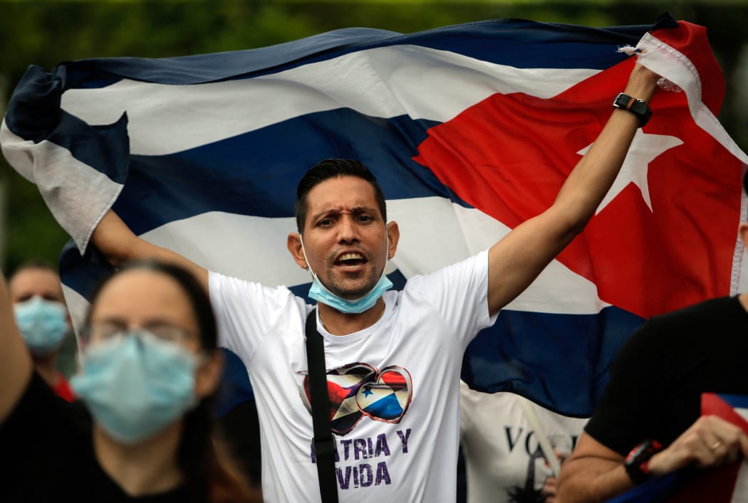 Cuban residents in Panama protest against the Cuban government near the Cuban Embassy in Panama City.