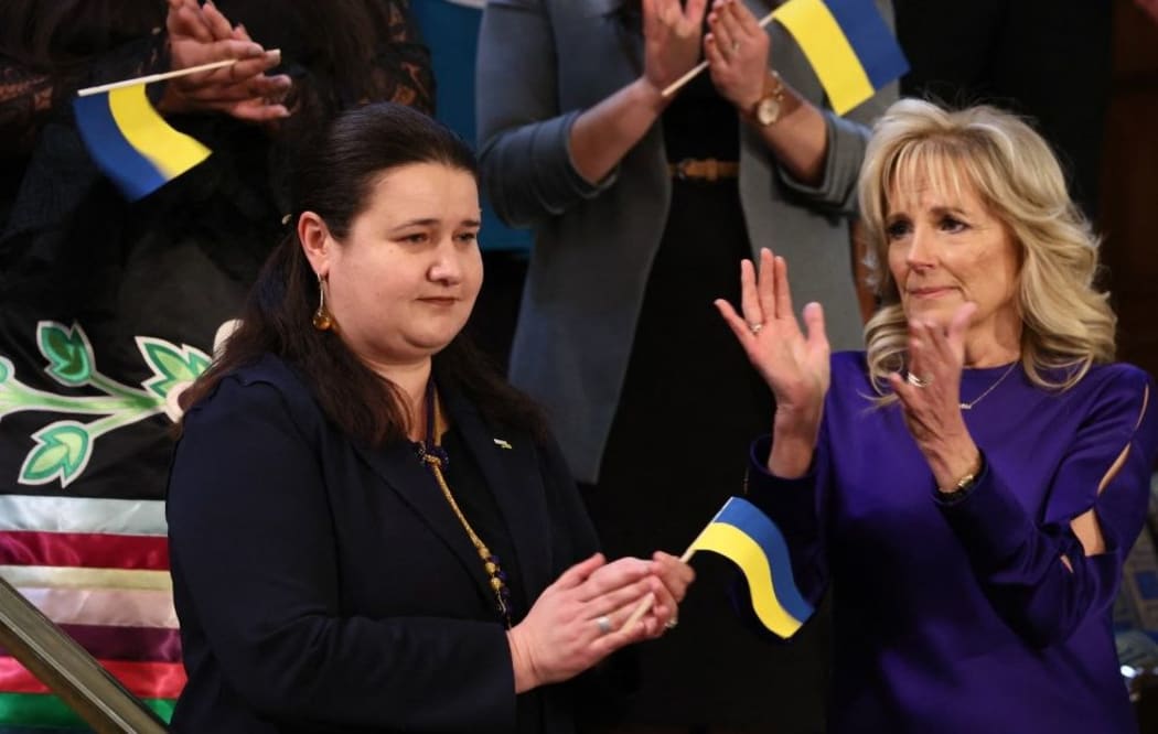 WASHINGTON, DC - MARCH 01: First Lady Dr. Jill Biden (R) applauds her guest Ukrainian Ambassador to the U.S. Oksana Markarova as U.S. President Joe Biden (C) arrives to deliver the State of the Union address