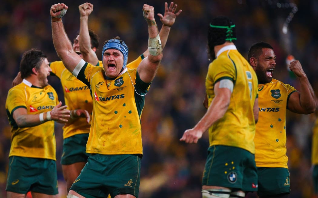 The Wallabies celebrate victory, 2015.