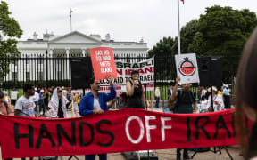Protesters gather outside the White House in Washington, DC, on June 22, 2025, condemning US airstrikes on Iranian nuclear facilities. Washington claims the strikes cripple Tehran's nuclear program, prompting Iranian threats against US bases in the Middle East. These attacks spark international concern over the escalation of regional tensions following Israel's bombing campaign against Iran in June. (Photo by Probal Rashid/NurPhoto) (Photo by Probal Rashid / NurPhoto via AFP)