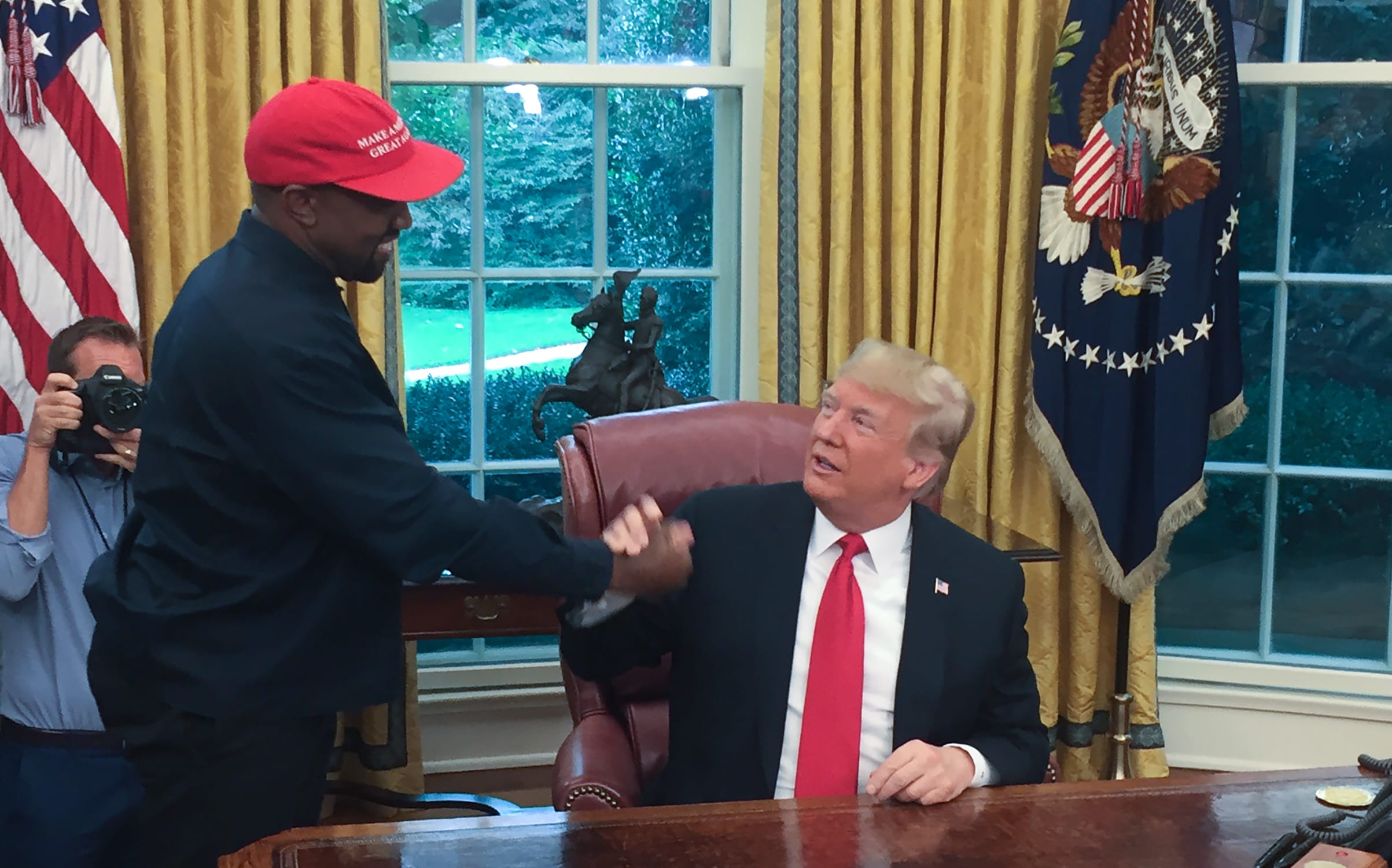 US President Donald Trump meets with rapper Kanye West in the Oval Office.