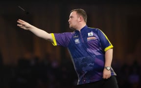 Luke Littler of England competing at the World Darts Championship at Alexandra Palace, London, England - 2023