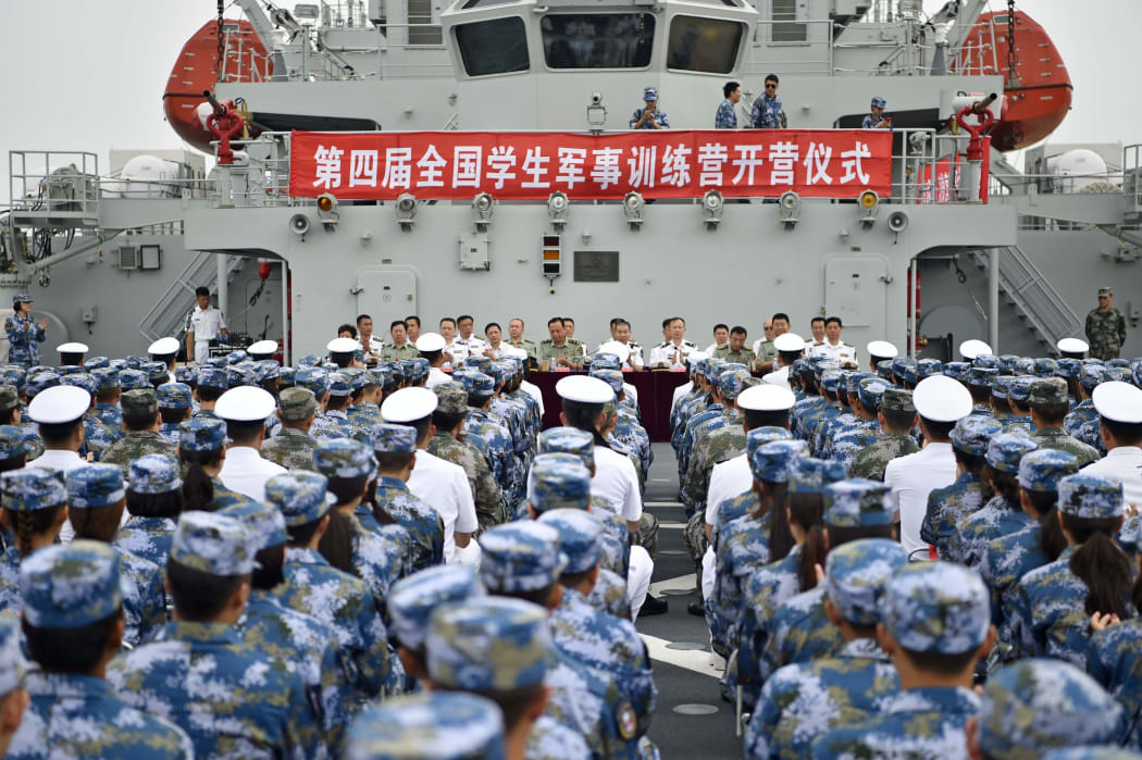 Photo taken on July 31, 2017 shows the opening ceremony of the 4th national military camp for students in Dalian, coastal city of northeast China's Liaoning Province.
