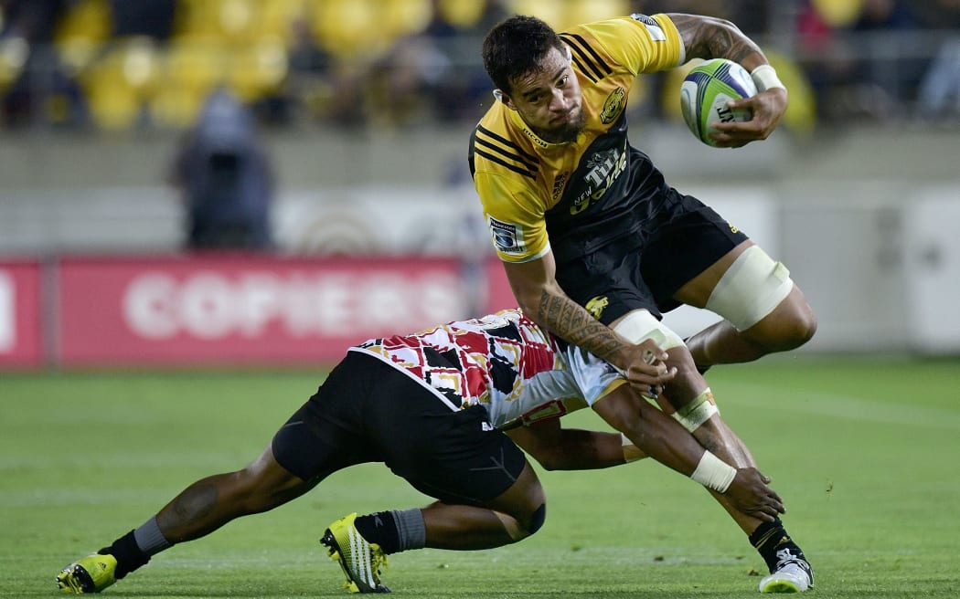 Vaea Fifita breaks the tackle by Ntando Kebe.