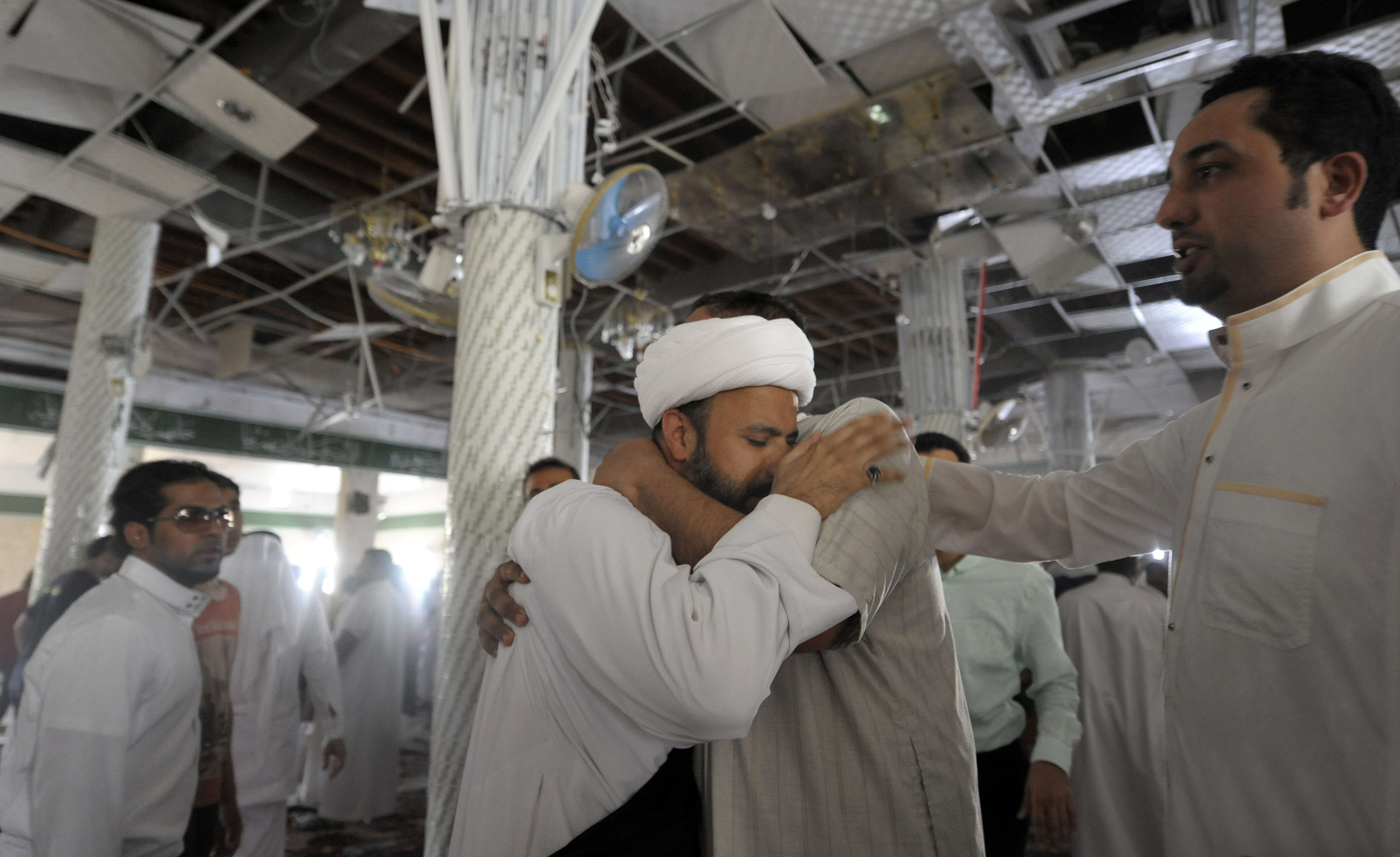A Saudi man reacts following the blast at the mosque in Qatif on 22 May.