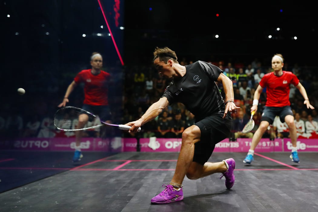 Paul Coll of New Zealand competes against James Willstrop of England in the Men's Singles Final