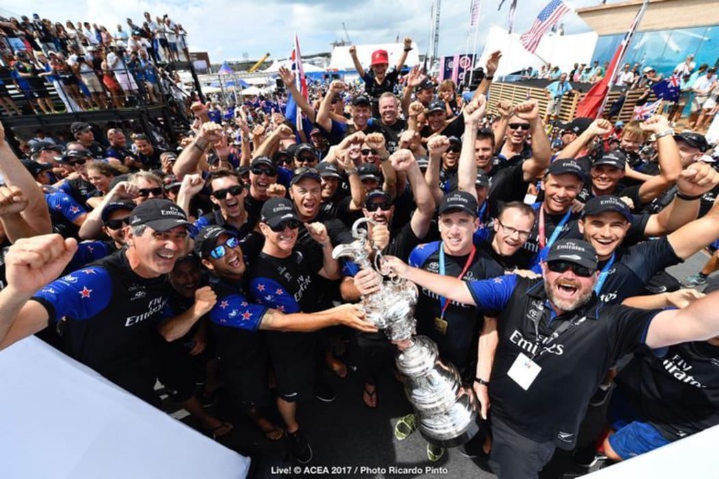 Team NZ celebrates their 7-1 win over Oracle Team USA in the 35th America's Cup