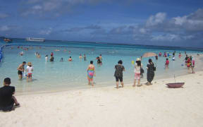 Asian tourists on a CNMI beach