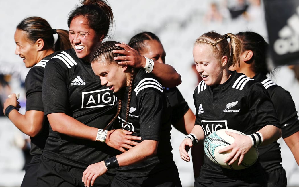 Selica Winiata (c) celebrates with teammates.