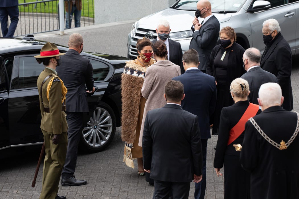 Dame Cindy is greeted by the Prime Minister, surrounded by their parties, including the Governor General's Aide de Camp and DPMC personnel keeping an eye on the approach of a few uninvited guests.