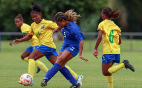 Samoa's Leah Manuleleua Solomon Islands Edith Nari. Women's Olympic Football Tournament, Oceania Qualifier Semi Final, Solomon Islands v Samoa, FFS Football Stadium Apia, Samoa, Friday 16 February 2024. Photo: Shane Wenzlick / www.phototek.nz