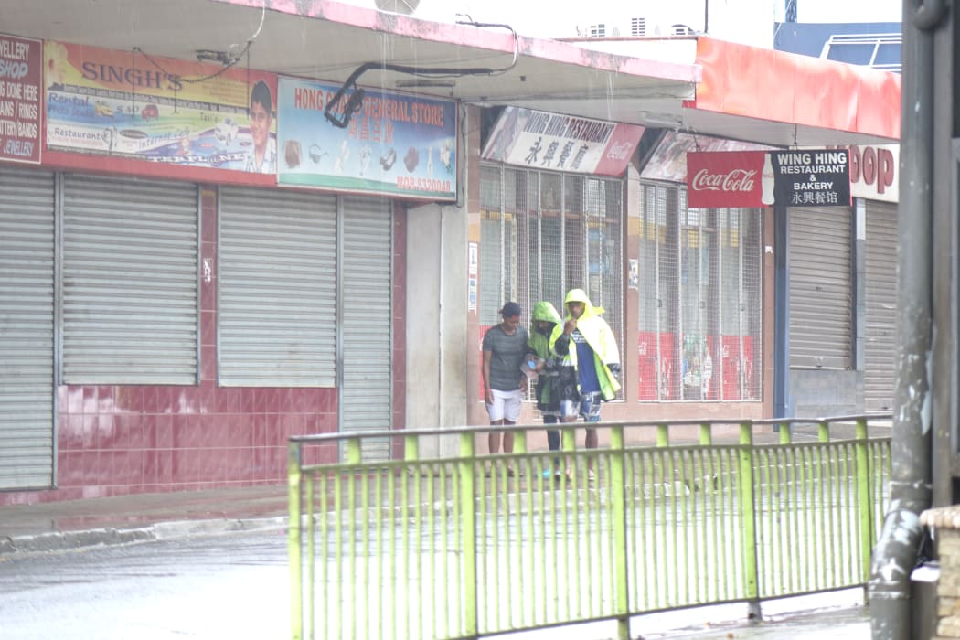 Sheltering from the rain in downtown Nadi, Fiji.