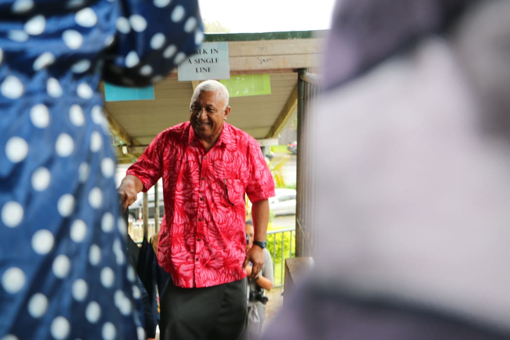 Frank Bainimarama on his way to cast his vote