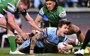 Billy Burns of the Sharks scores a try against the Raiders.