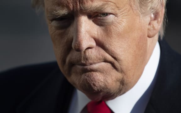 US President Donald Trump speaks as he arrives at the White House in Washington, DC, on January 6, 2019, after meetings at Camp David.