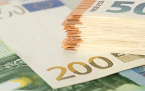 98866939 - many euro banknotes