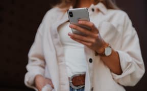 Someone holding a mobile phone