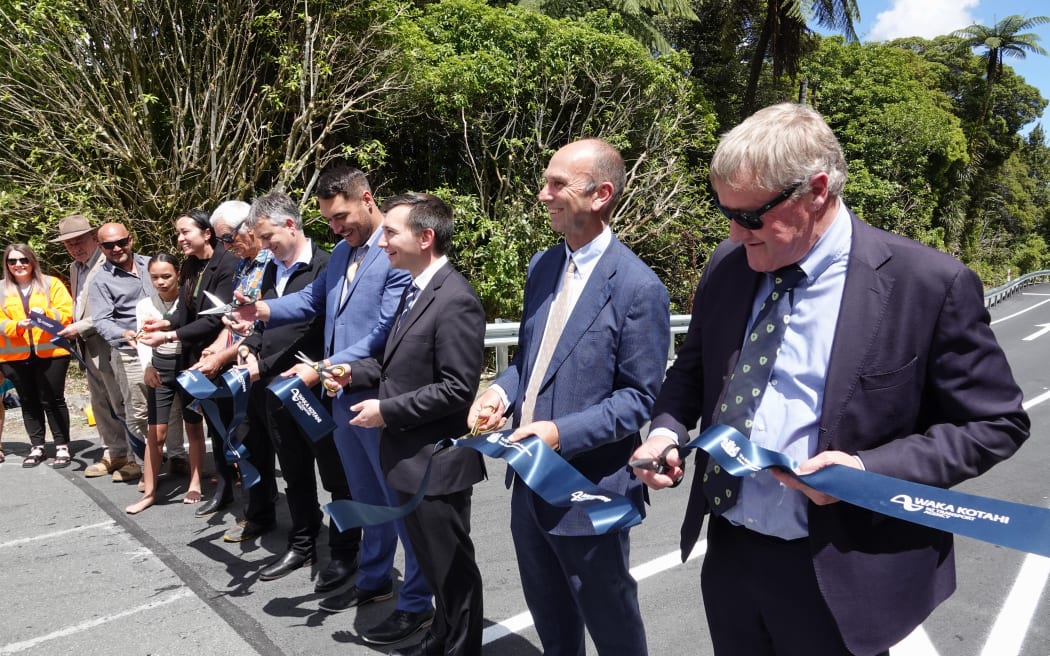 Dignitaries including, from right, Northland MP Grant McCallum, NZTA director regional relationships Steve Mutton, Transport Minister Simeon Brown and Far North Mayor Moko Tepania, cut a ribbon to celebrate the opening of SH1.