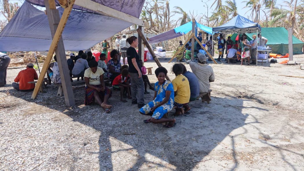 Medical need - Mataso village residents queue up to be assessed.
