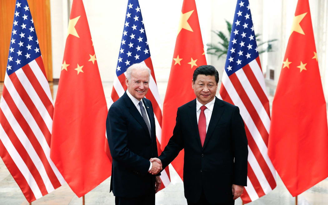 Chinese President Xi Jinping (right) shakes hands with US Vice President Joe Biden inside the Great Hall of the People in Beijing in December, 2013.