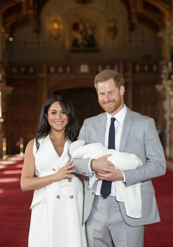 Britain's Prince Harry and Meghan, Duchess of Sussex, during a photocall with their newborn son, in St George's Hall at Windsor Castle, Windsor, south England, Wednesday May 8, 2019.