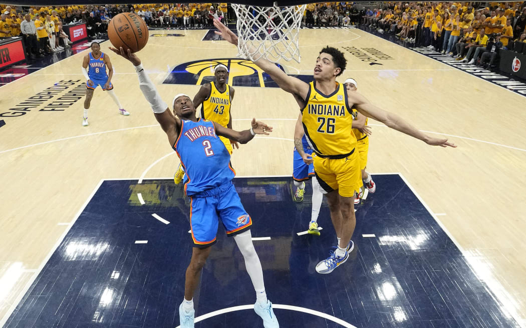INDIANAPOLIS, INDIANA - JUNE 19: Shai Gilgeous-Alexander #2 of the Oklahoma City Thunder attempts a shot against Ben Sheppard #26 of the Indiana Pacers during the third quarter in Game Six of the 2025 NBA Finals at Gainbridge Fieldhouse on June 19, 2025 in Indianapolis, Indiana. NOTE TO USER: User expressly acknowledges and agrees that, by downloading and or using this photograph, User is consenting to the terms and conditions of the Getty Images License Agreement.   Abbie Parr - Pool/Getty Images/AFP (Photo by POOL / GETTY IMAGES NORTH AMERICA / Getty Images via AFP)