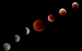 A montage of pictures shows the phases of the Blood Moon Total Lunar Eclipse as it is seen in Depok City, West Java province, Indonesia, on September 8, 2025. (Photo by Aditya Irawan/NurPhoto) (Photo by Aditya Irawan / NurPhoto via AFP)