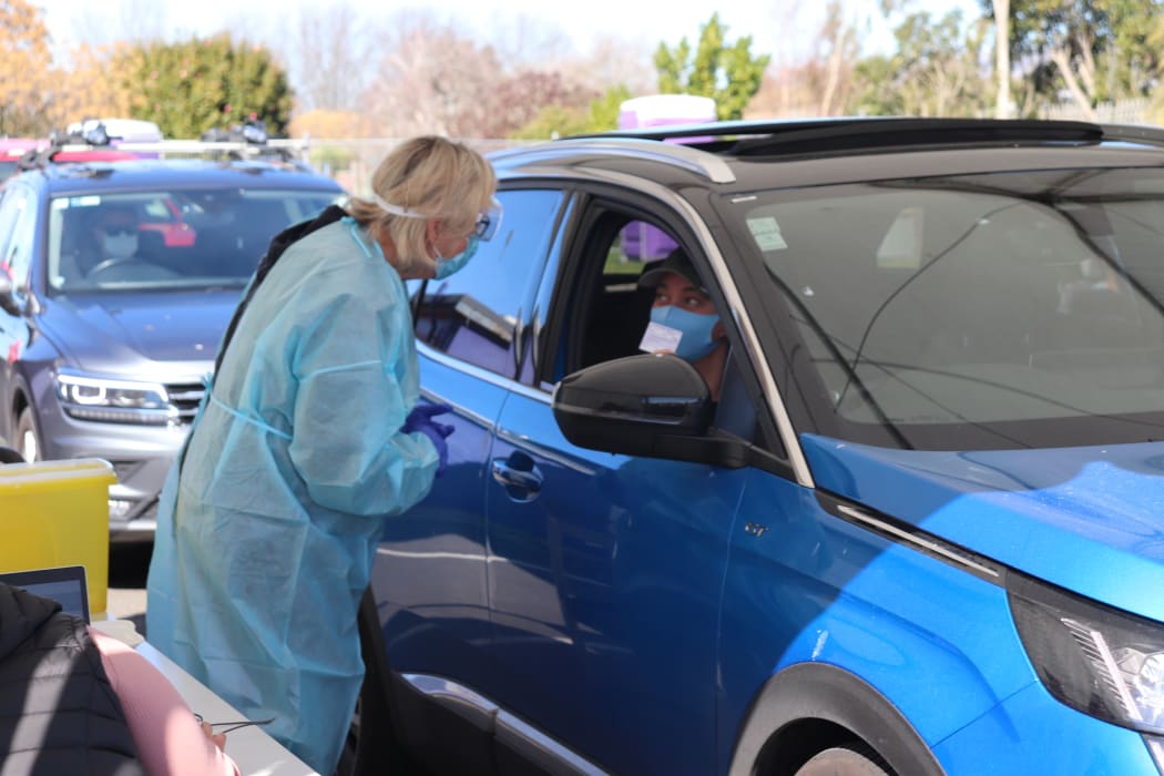 Monique Heki about to get her second Covid-19 vaccination from her car.